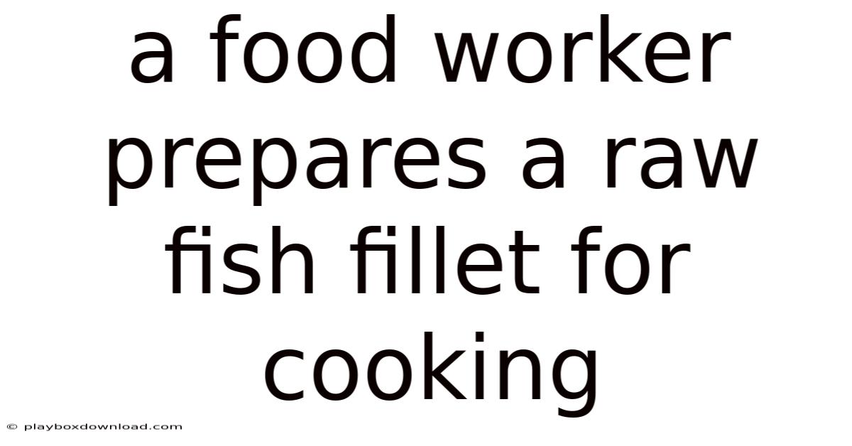 A Food Worker Prepares A Raw Fish Fillet For Cooking